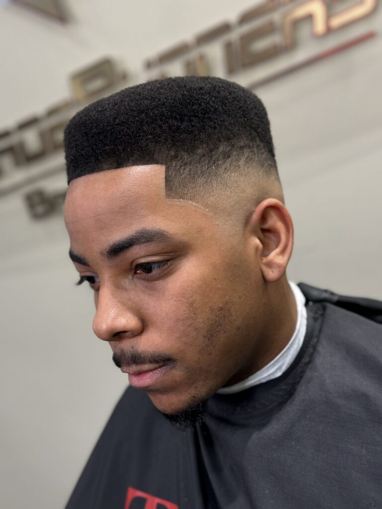 Young man with high-top fade haircut