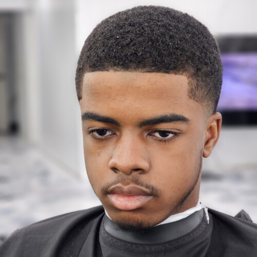Man with fresh haircut in barbershop