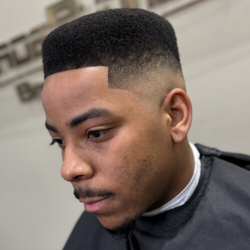 Young man with high-top fade haircut